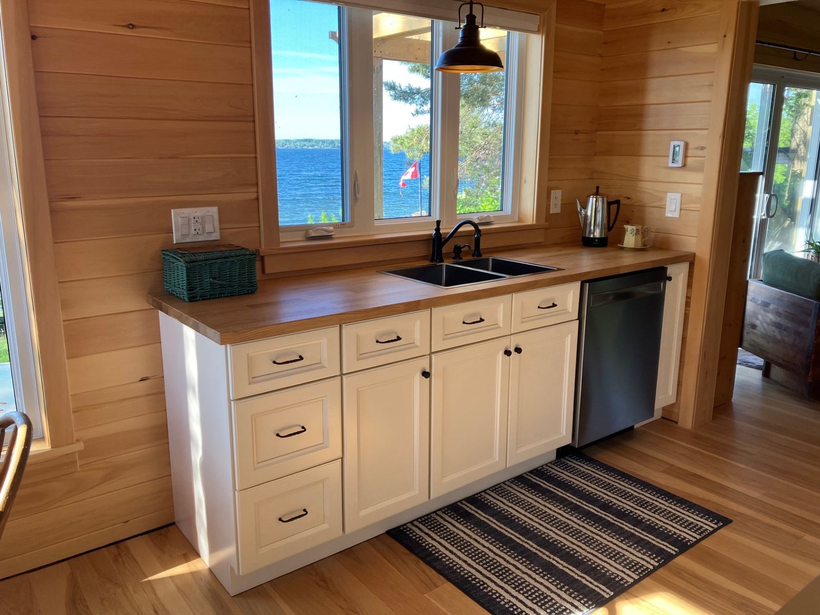 Cottage kitchen with Canada Kitchen York White cabinets and a butcher-block counter